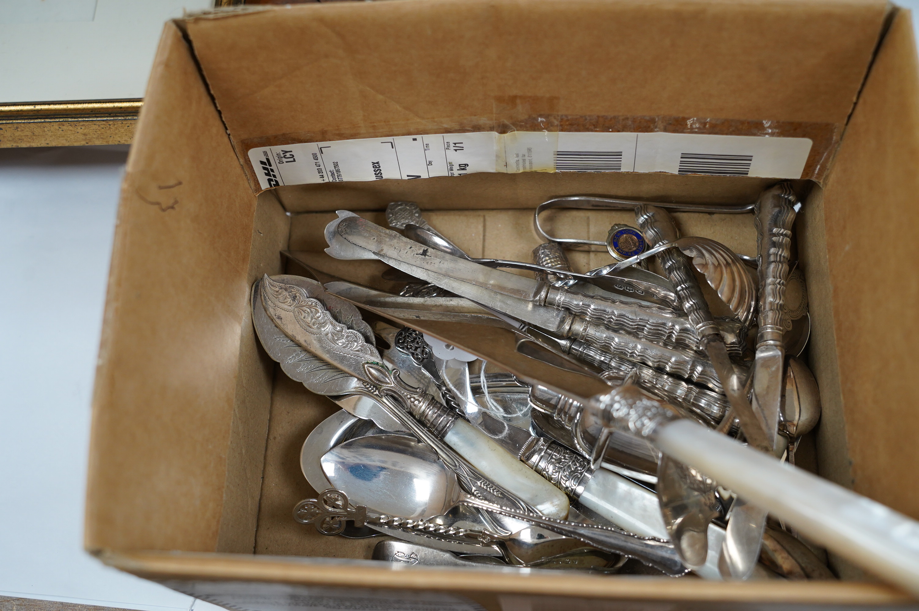 A small group of assorted teaspoons, condiment spoons, small servers, etc. including a Millennium seal top spoon by A. E. Jones Ltd and a Victorian shell bowl ladle by Jehoiada Alsop Rhodes and a silver thimble together